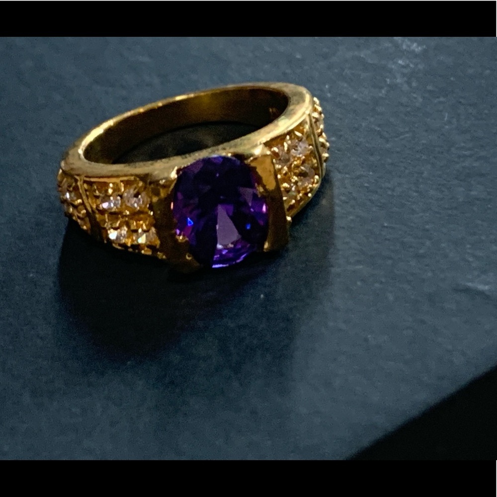 Gold ring with purple stone